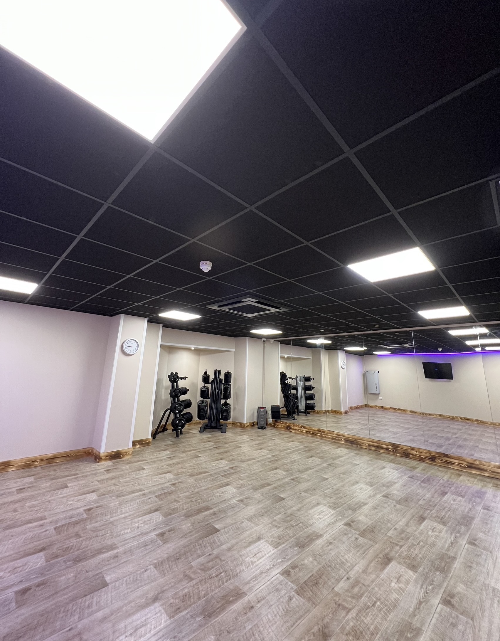 Gym with pannels in the roof replaced with lights